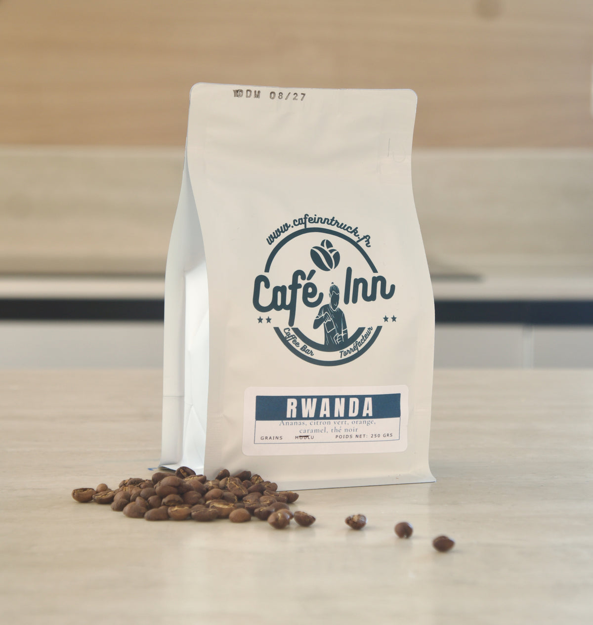 Grains de café Rwanda Cyiya 843 à côté du sachet Café Inn